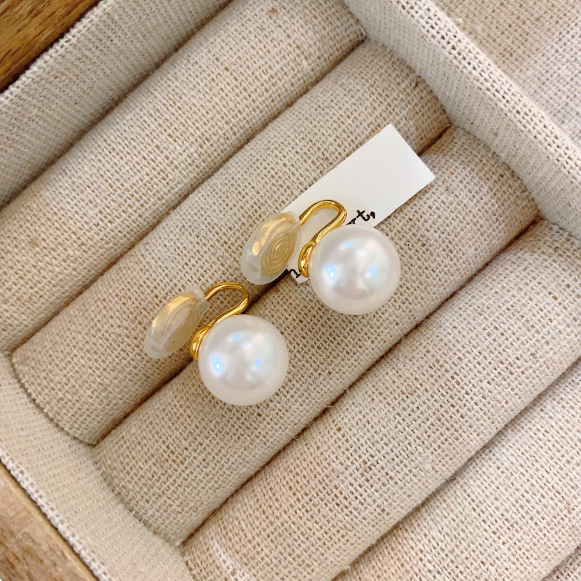 Shi Jiaping for pearl ear clips without ear piercings, light luxury, niche design sense, advanced mosquito coil disc, ear bone clip, earrings, studs.