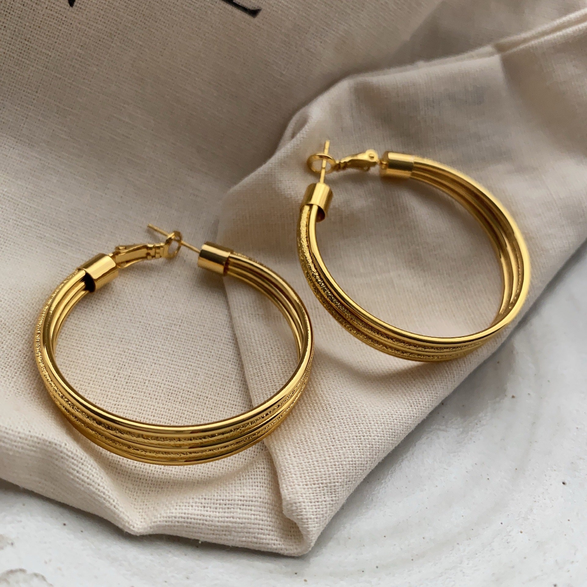 Internet celebrity explosion gold earrings literary retro temperament versatile ring niche design European and American fan full earrings women