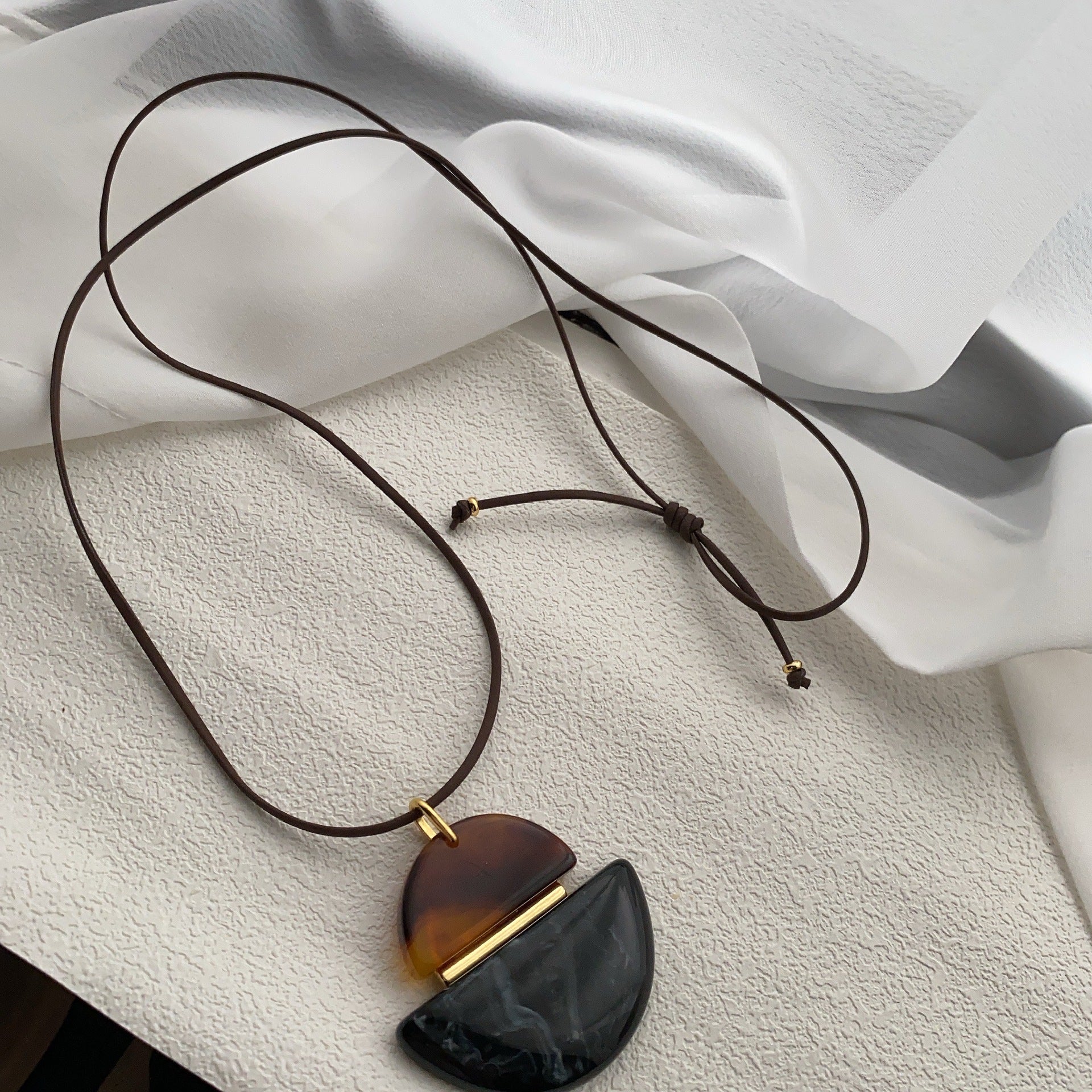 Korean amber resin pendant, black rope necklace, women's simple niche fashion commuter temperament versatile neck chain sweater